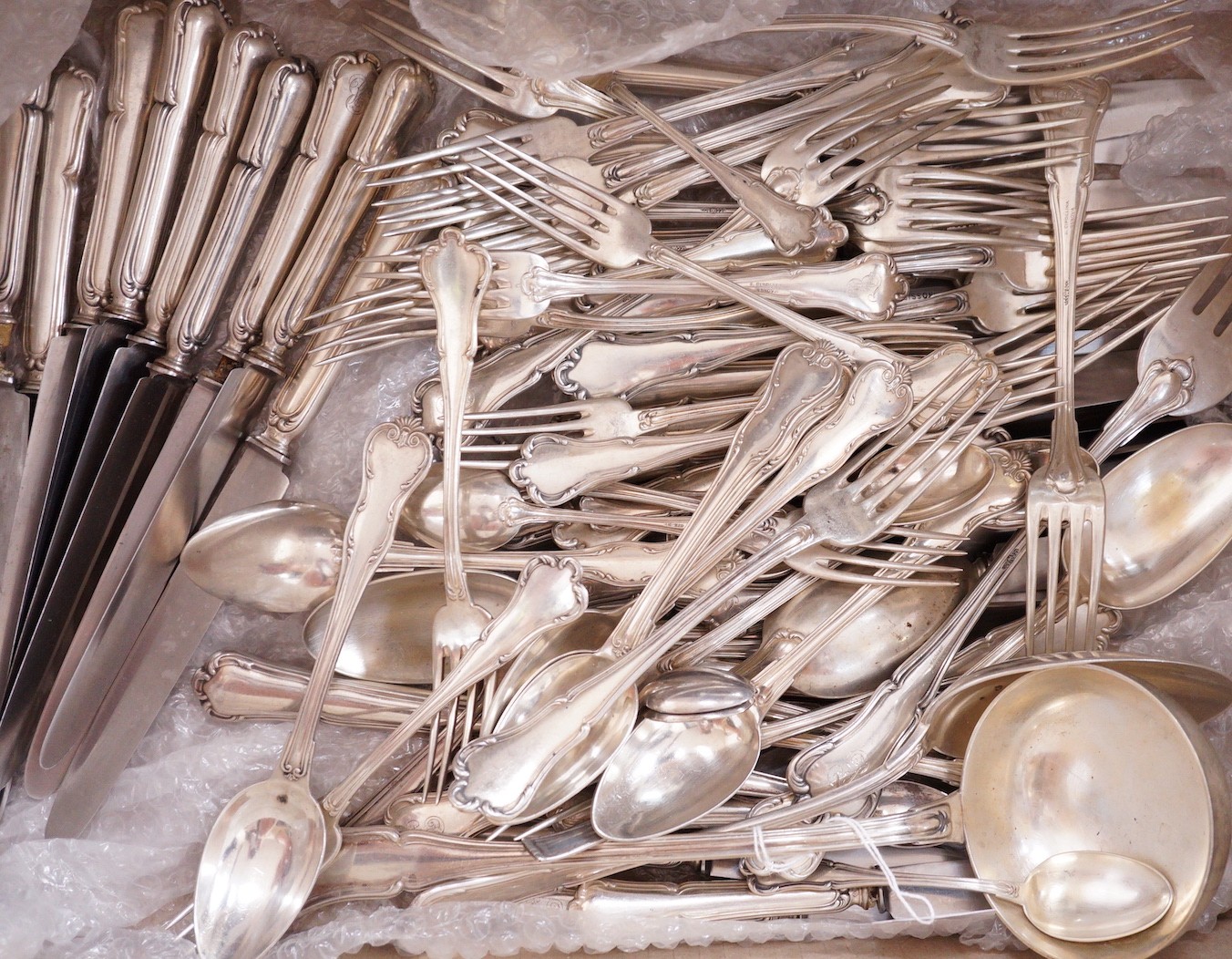 A harlequin part canteen of mainly early 20th century Italian 800 standard white metal Venetian pattern cutlery, comprising eighty items